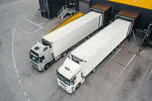 Trucks leaving a warehouse to illustrate the affects of an aftermarket NOx sensor
